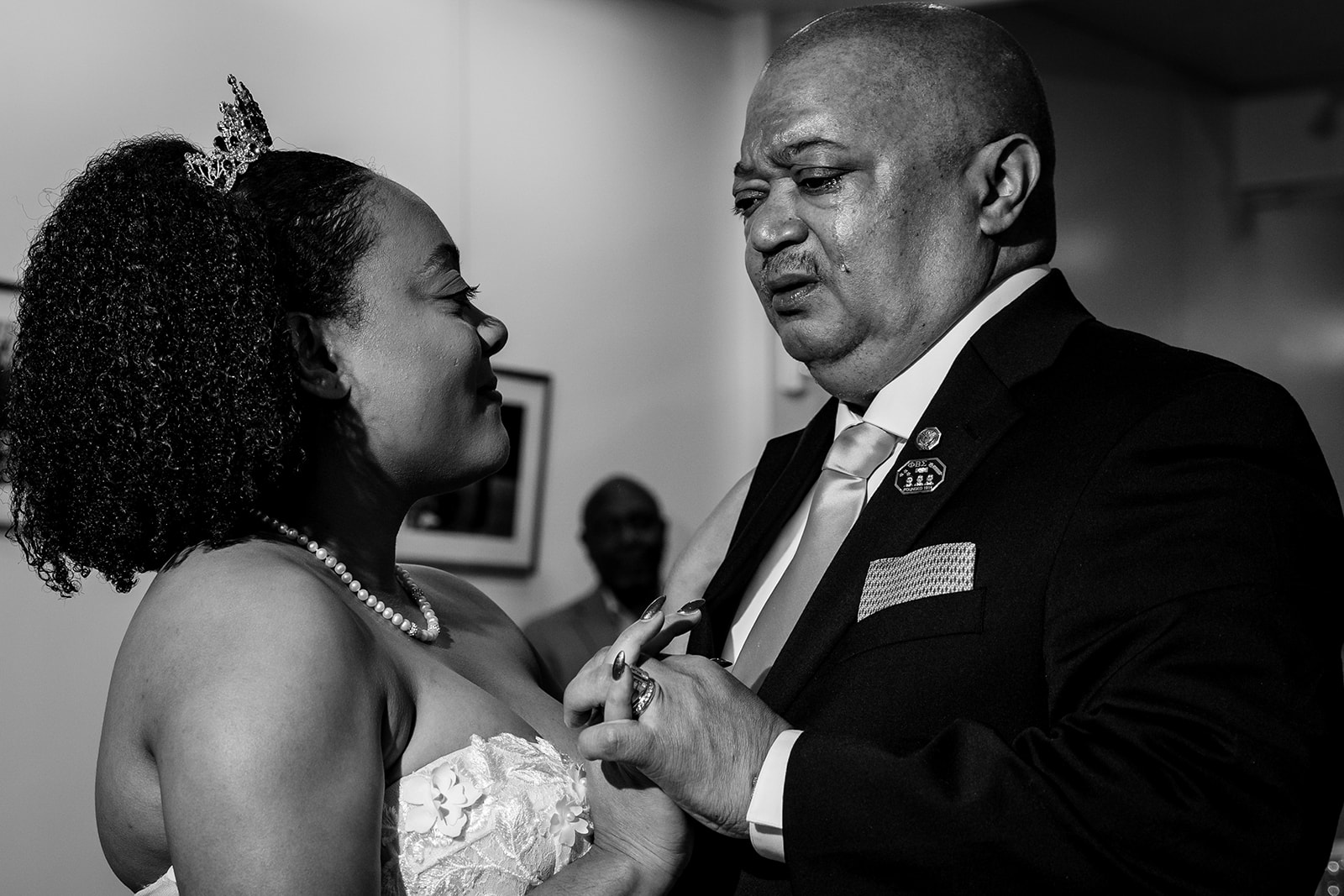 Emotional parent moment at a Georgetown DC wedding, documentary-style black and white wedding photography capturing connection and family.