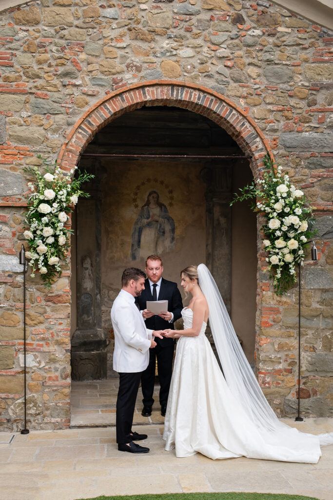 Micro wedding ceremony at La Monastica in Tuscany
Stone arch ceremony at Tuscany micro wedding venue
Bride and groom portrait at La Monastica wedding