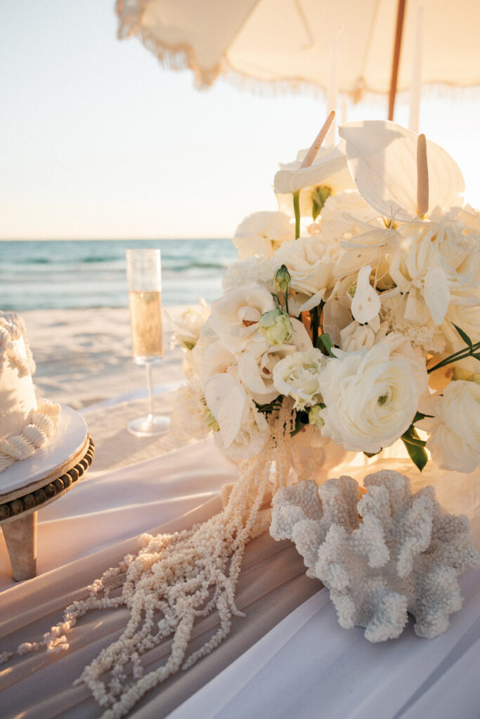 Coastal table styling with oysters, neutral linens, and organic florals