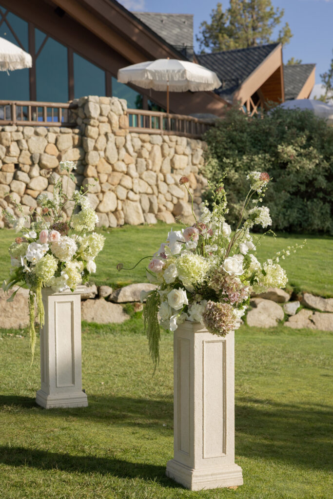 Overflowing wedding ceremony arch with blush and white florals | Willow and Magnolia wedding florist

romantic wedding florist