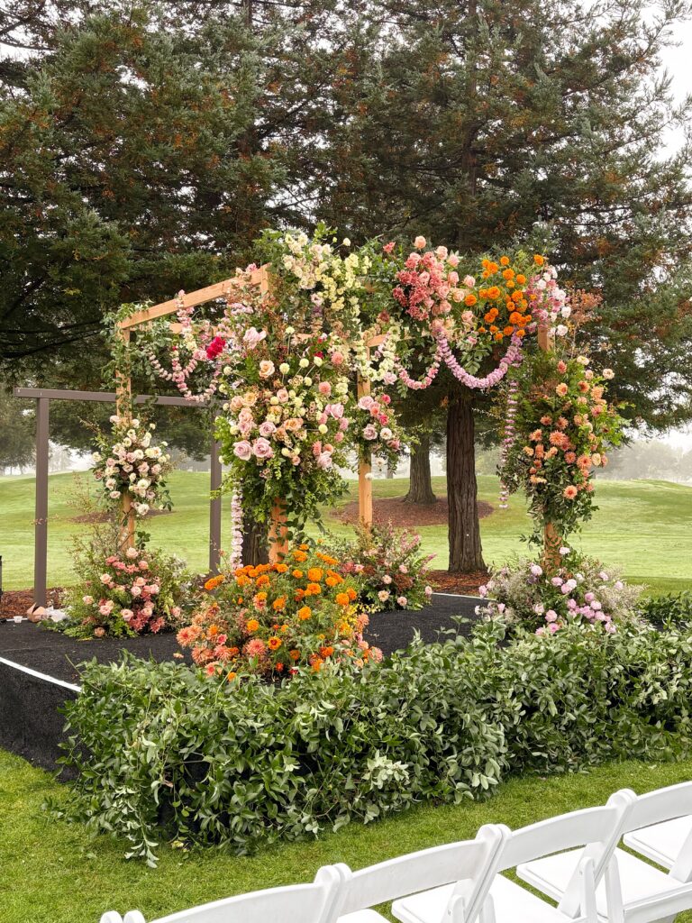 Overflowing wedding ceremony arch with blush and white florals | Willow and Magnolia wedding florist
Napa wedding florist

romantic wedding florist