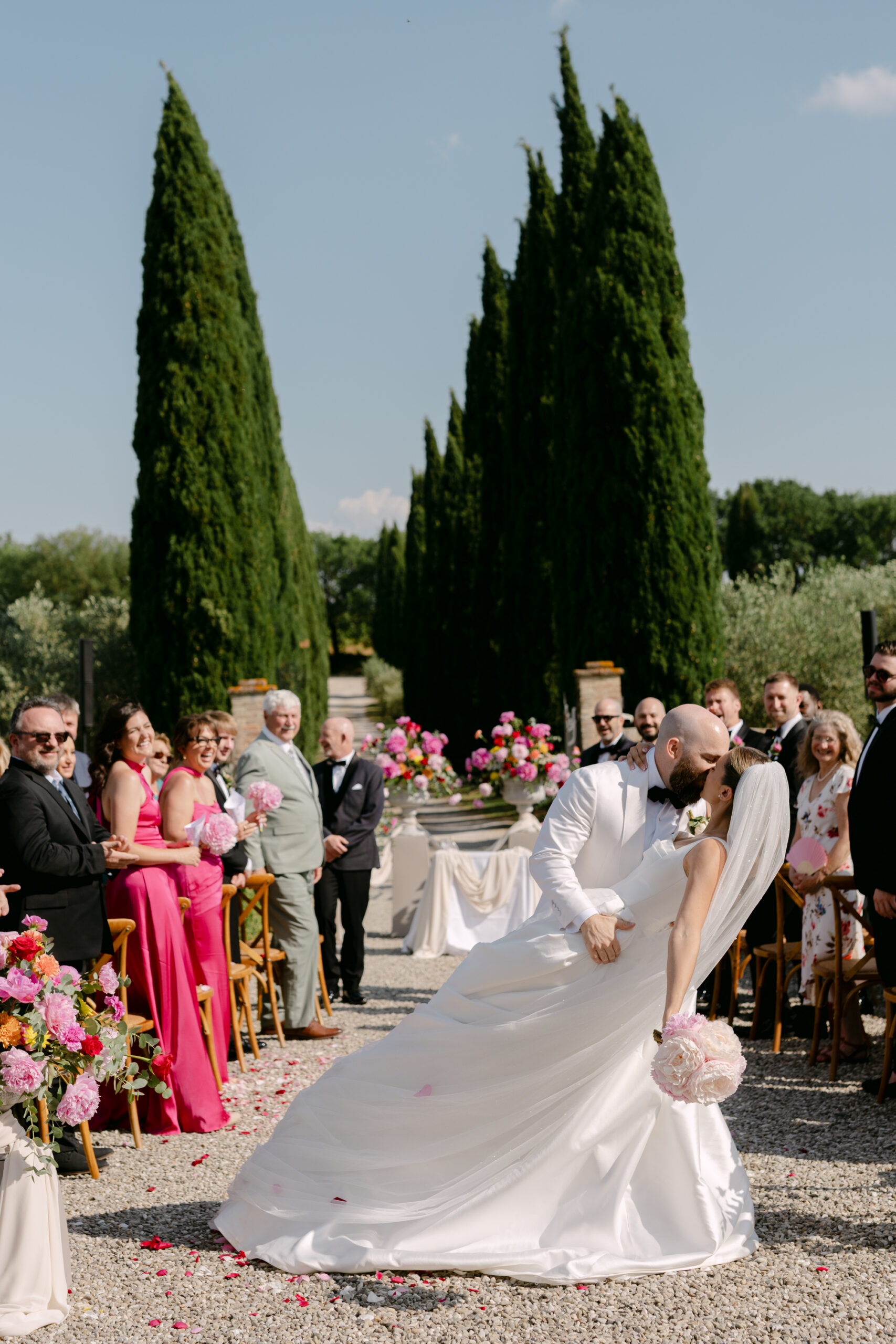 Groom overcome with emotion as guests celebrate during a Jewish wedding ceremony at Villa Boscarello Tuscany