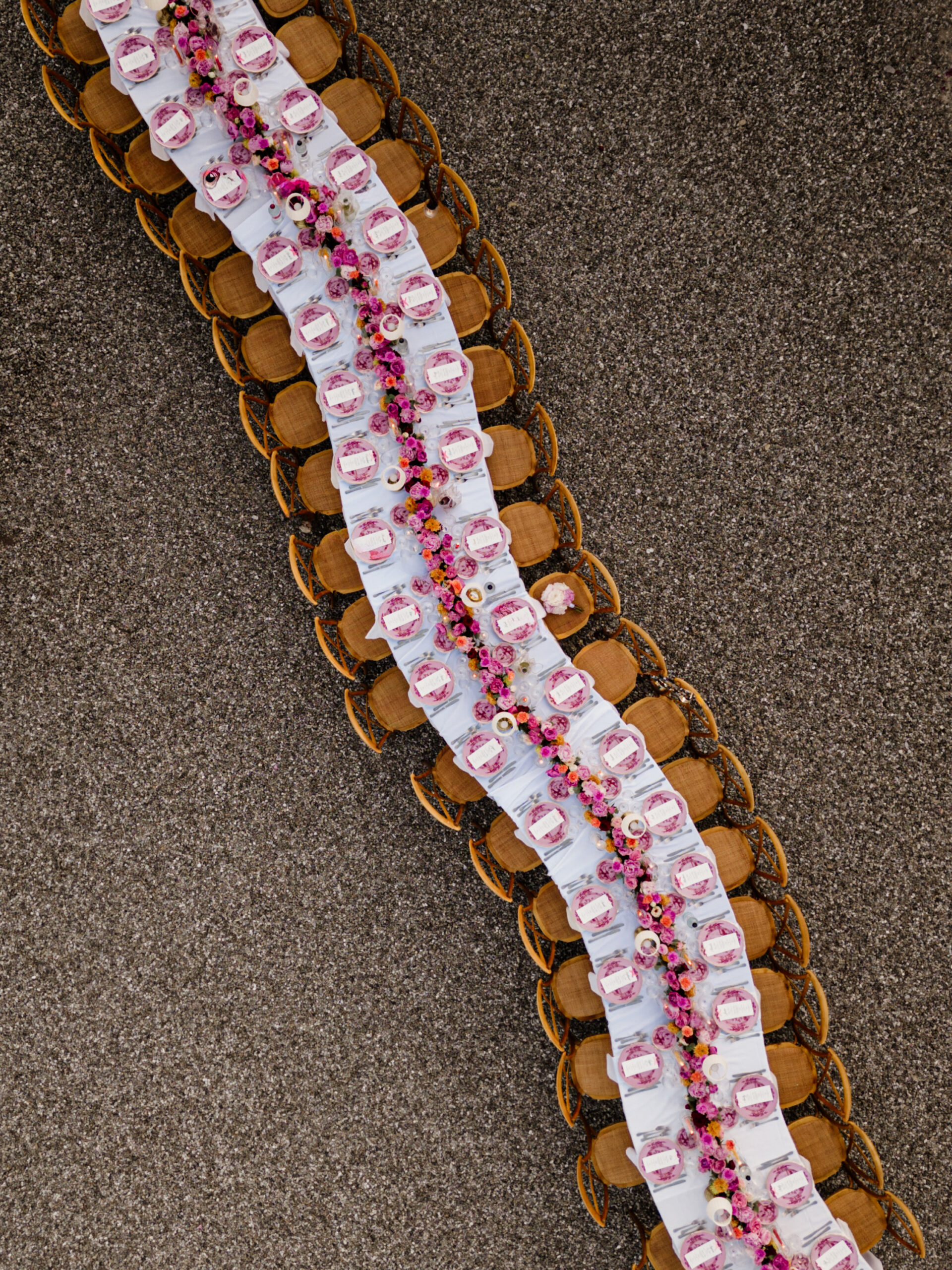 Overhead detail of wedding favors styled on wood slices at a Tuscan pizza party, Villa Boscarello wedding weekend