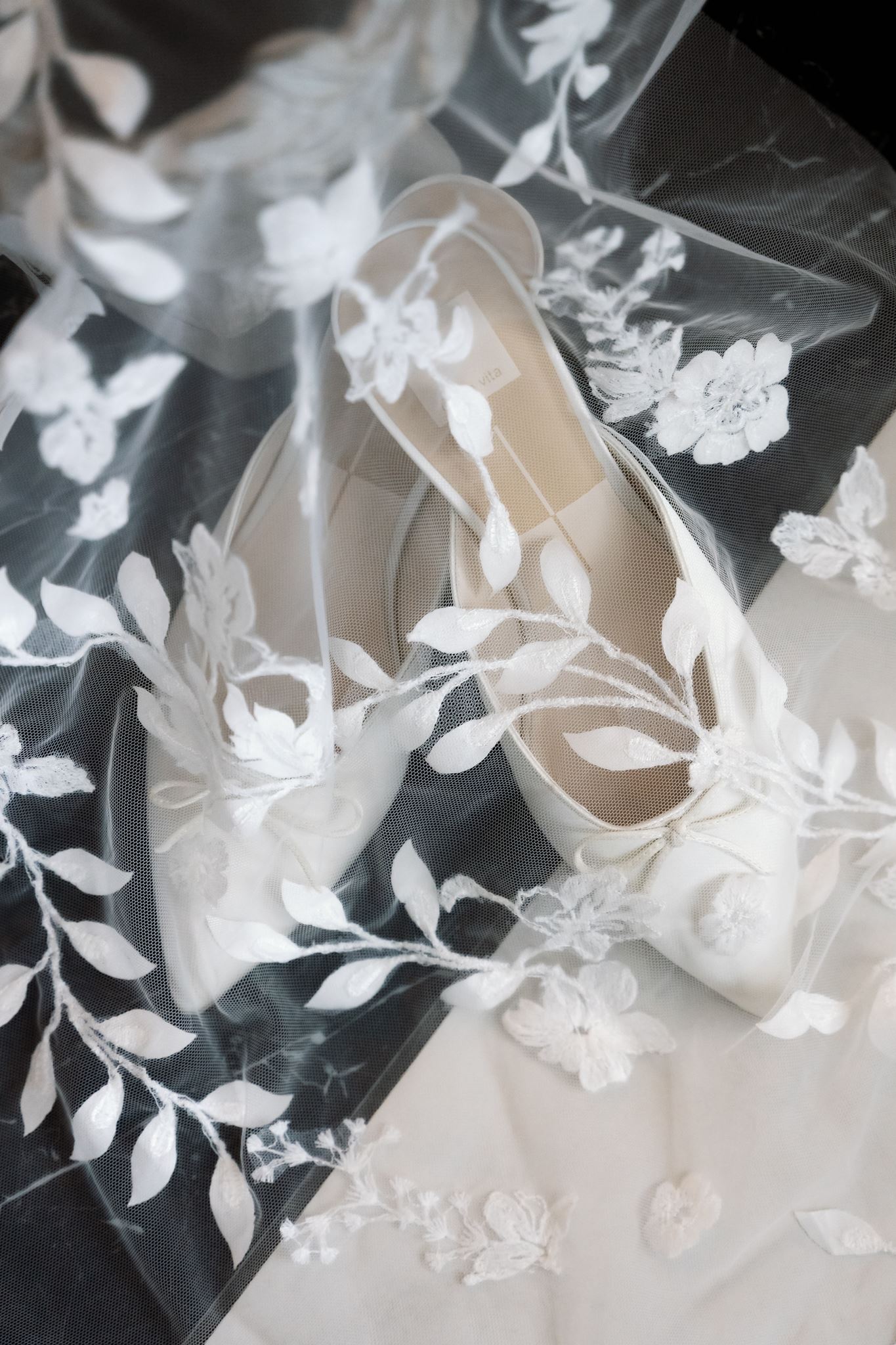 Bridal shoes and embroidered veil detail