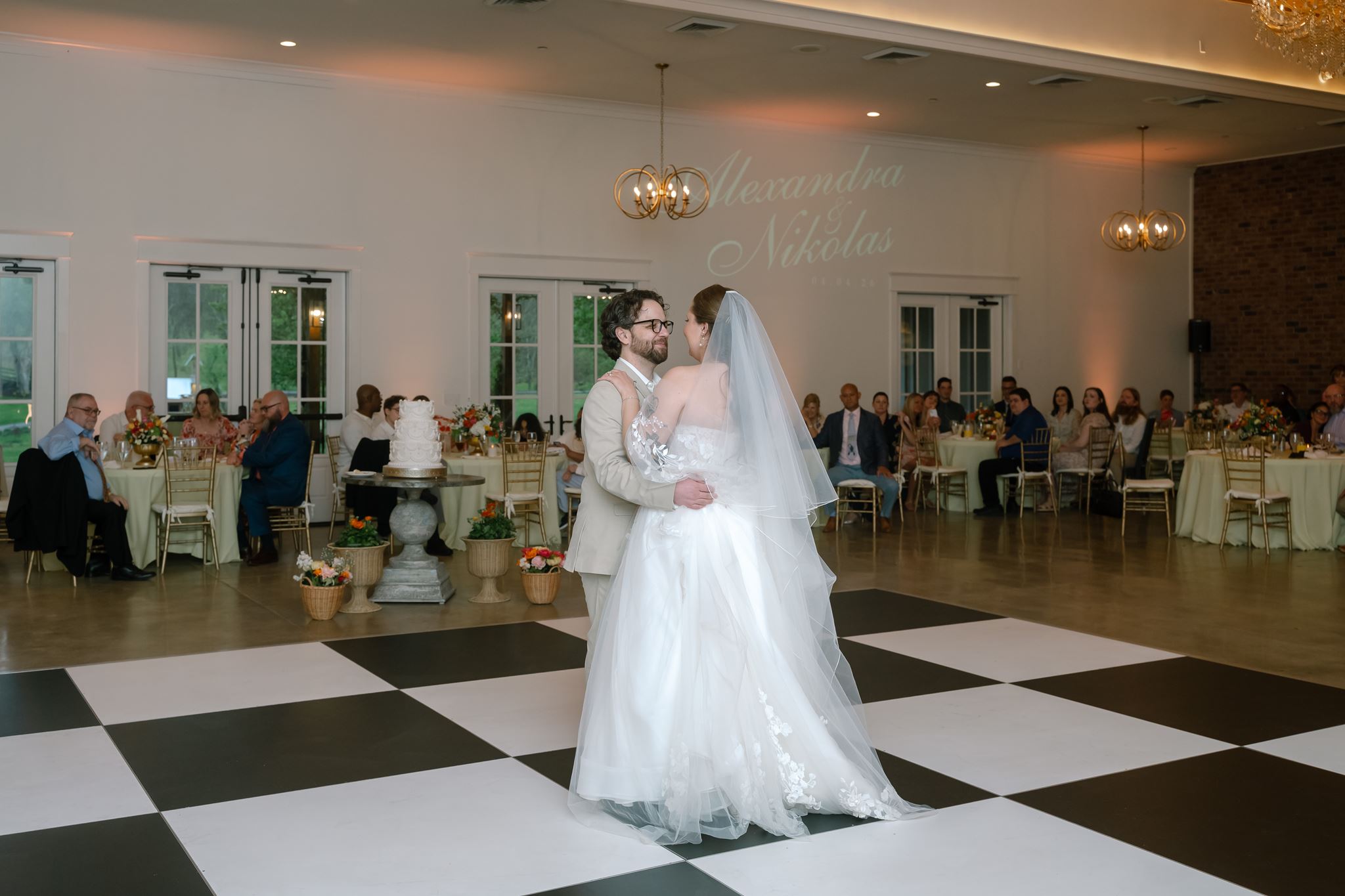 First dance with Alexandra and Nikolas in lights on the wall