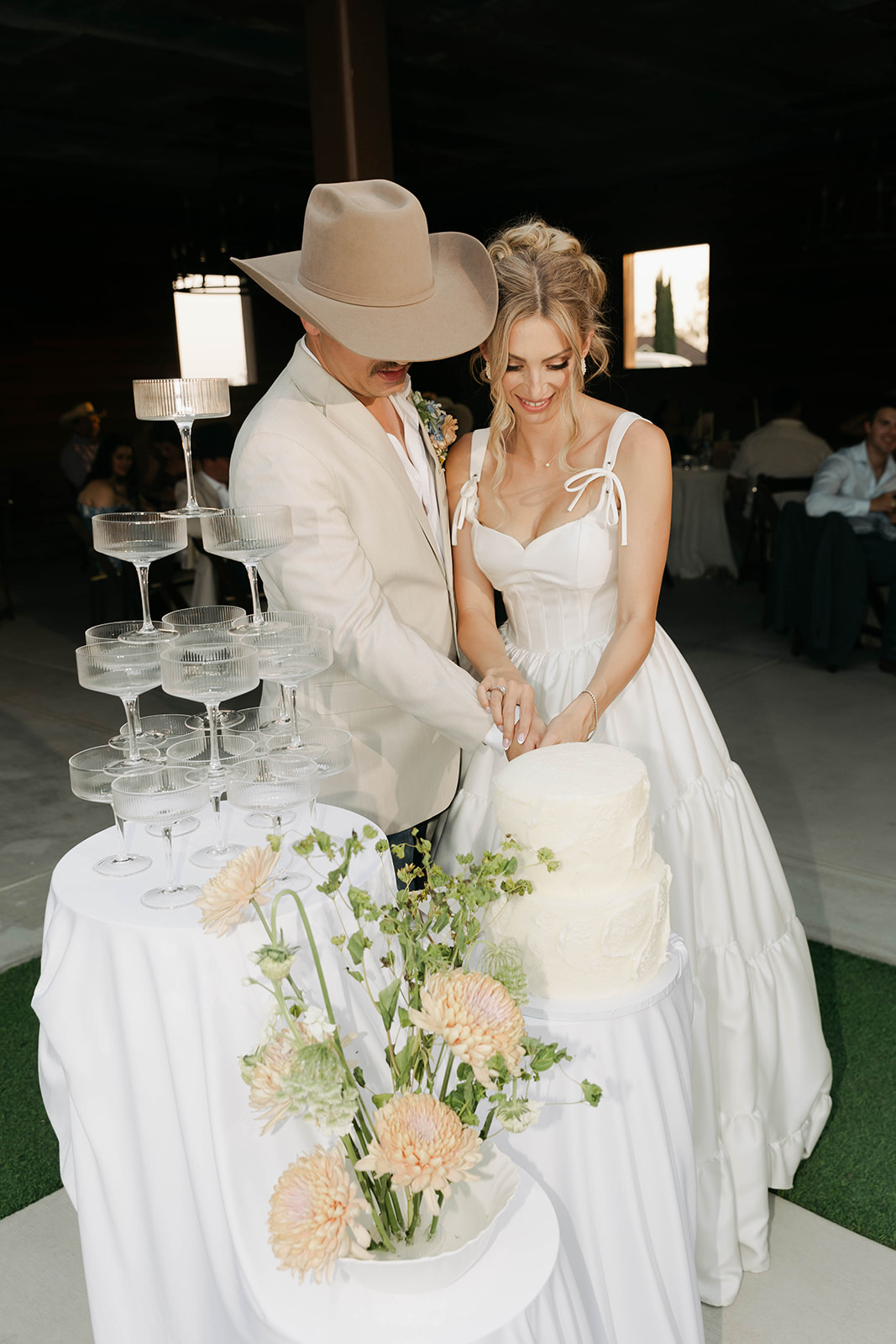 Cake cutting beside the champagne tower