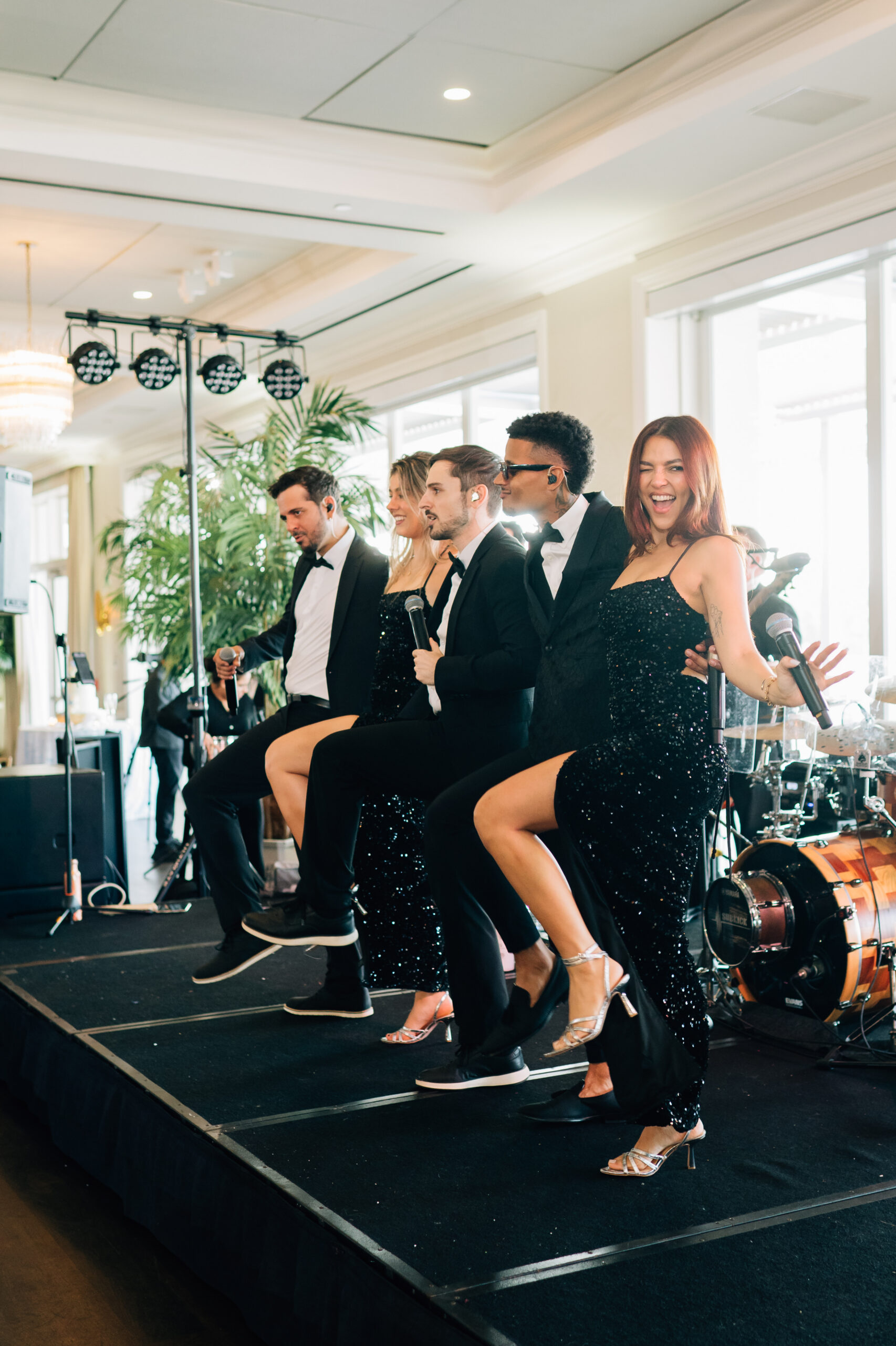 The Clique Band performing for a packed dance floor