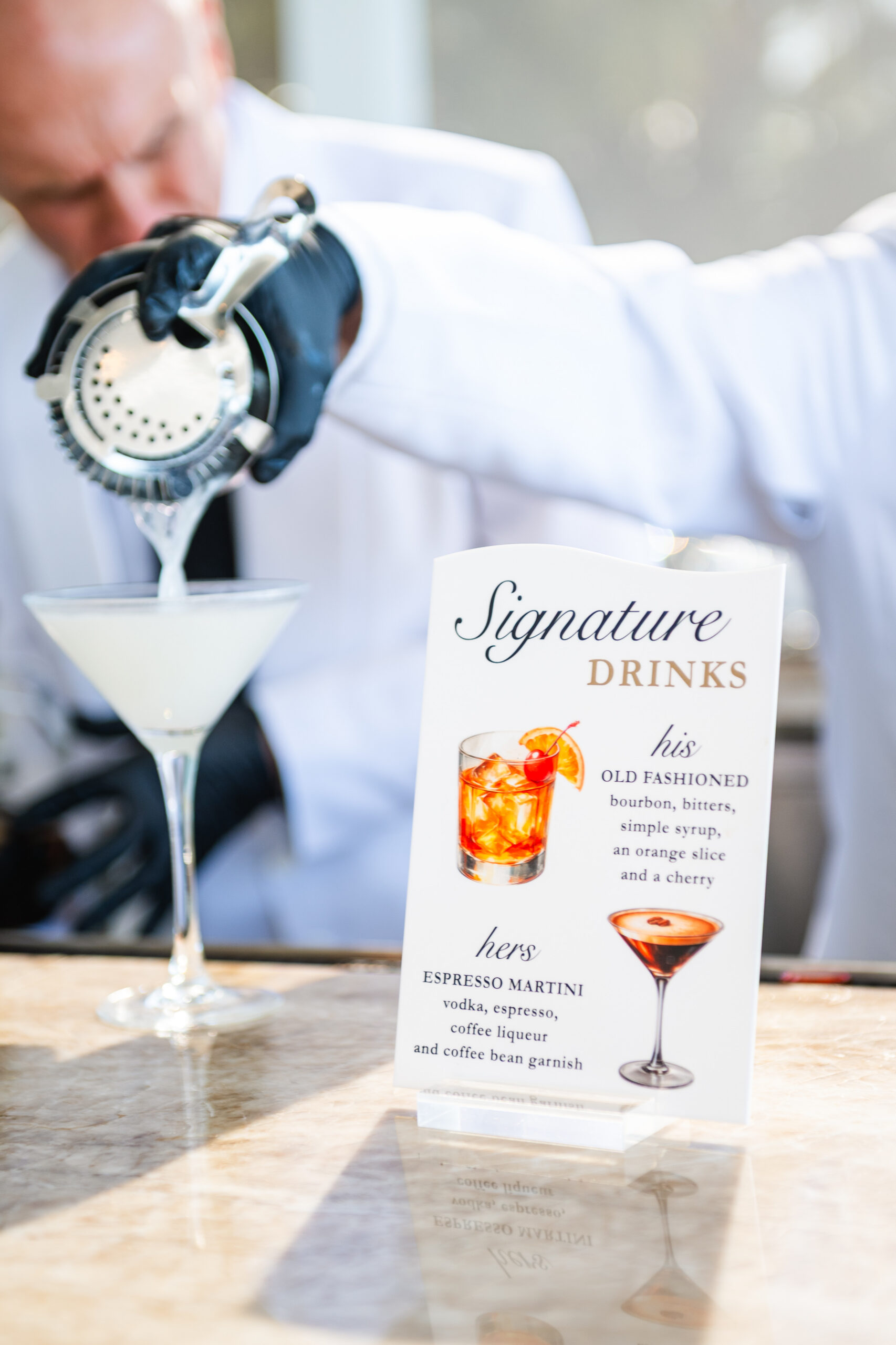 A signature drink being poured at the bar