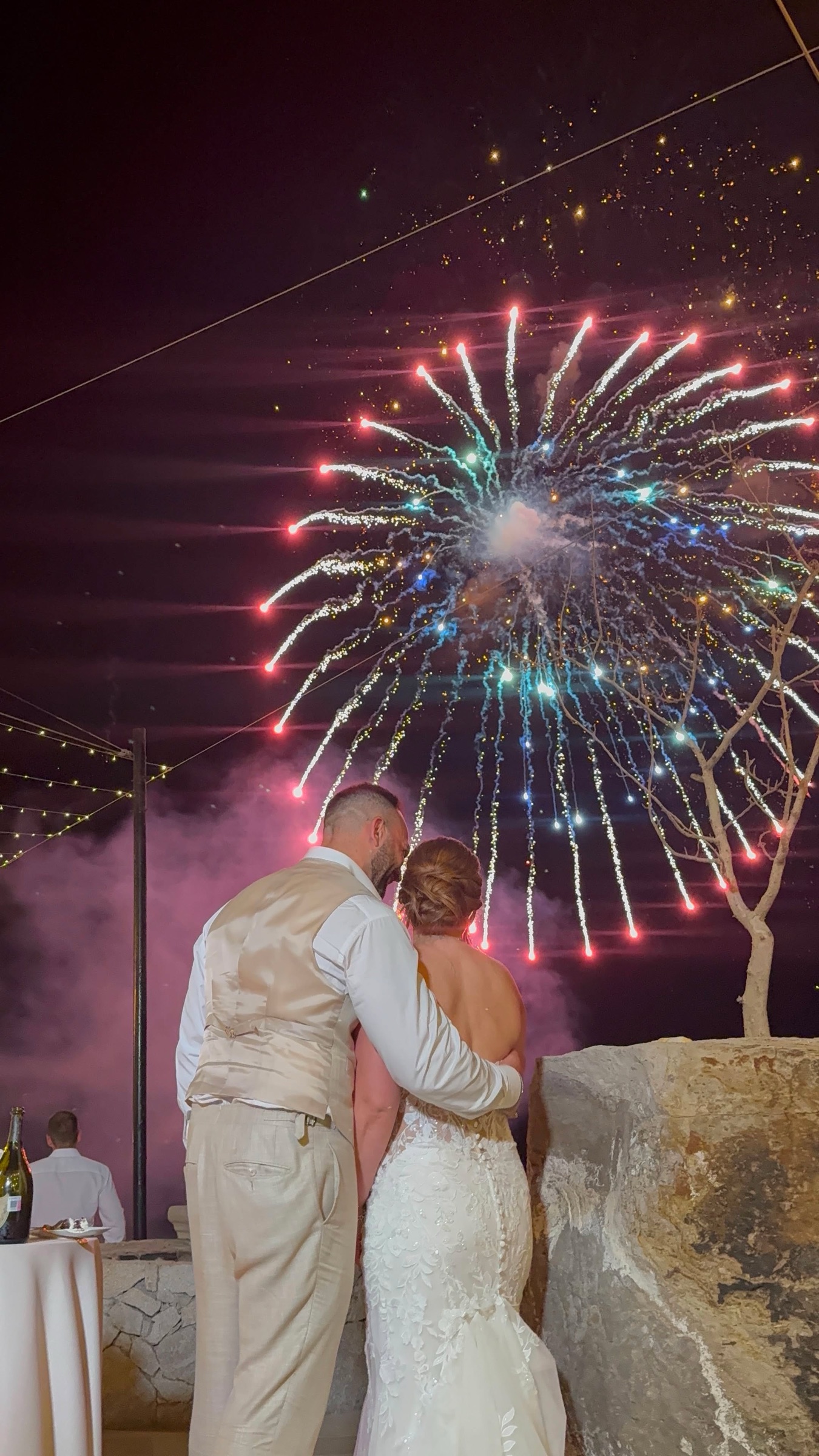 The couple watching fireworks over the Sea of Cortez