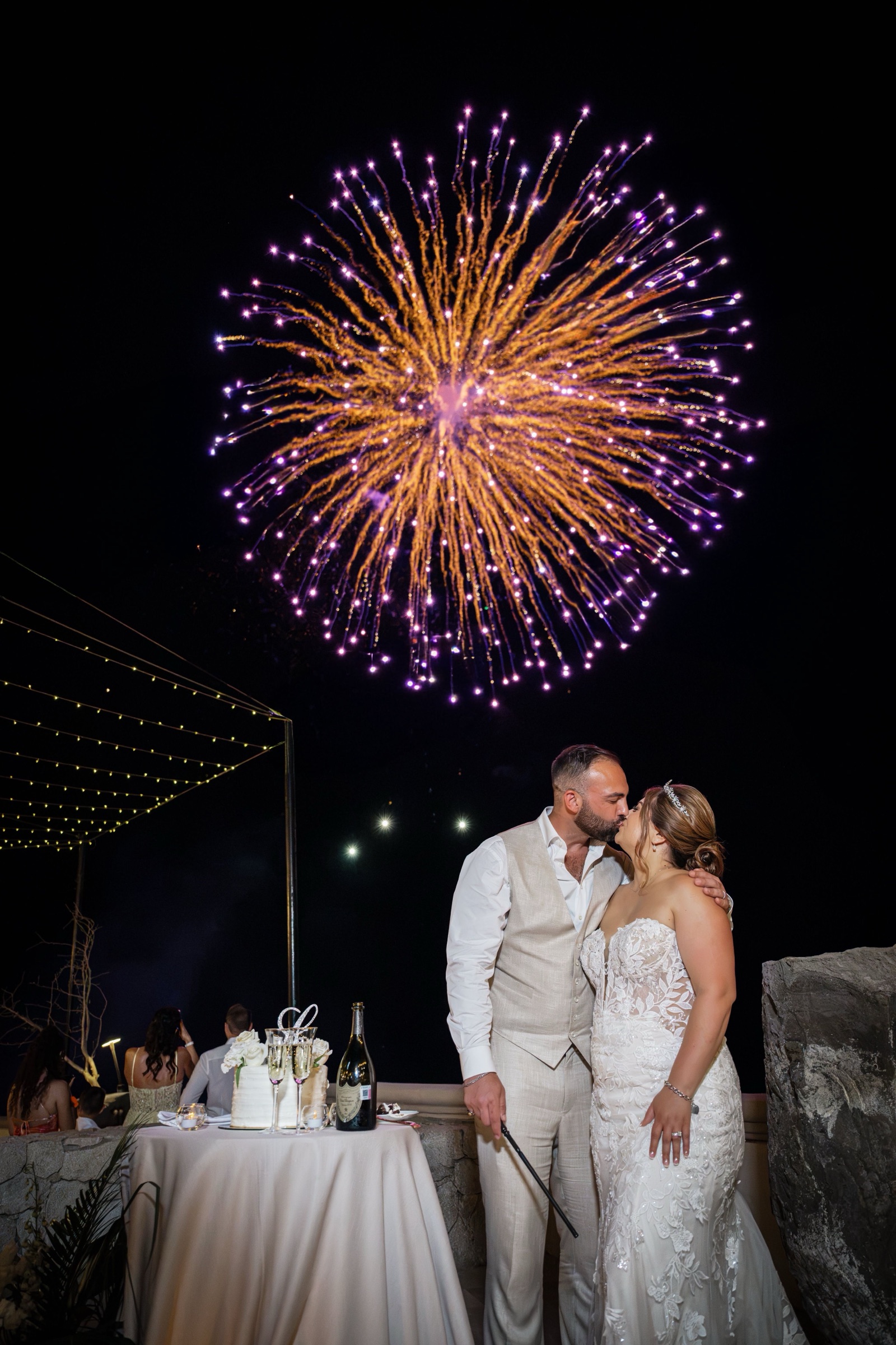 Gabriella and Michael share a kiss beneath the fireworks finale