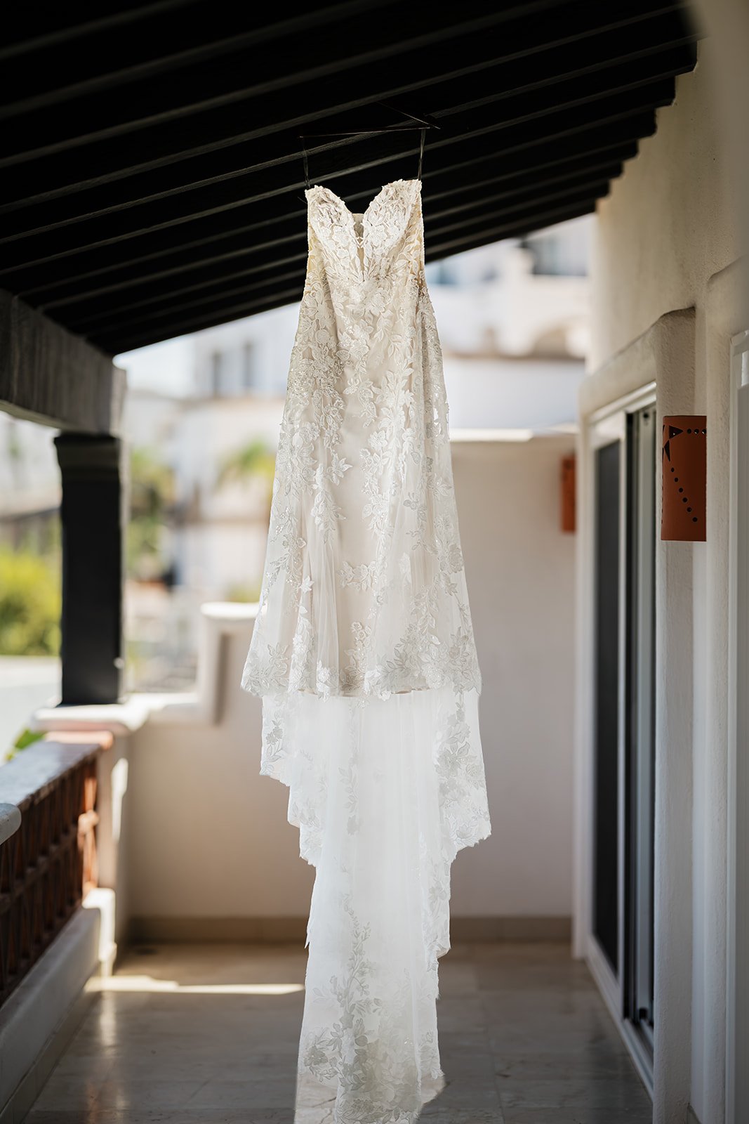 Wedding dress hanging in the doorway