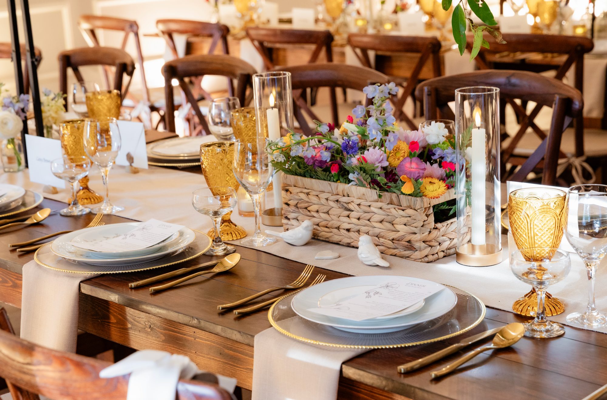 Wildflower basket centerpiece with inherited china and handwritten menu at a Maryland garden wedding