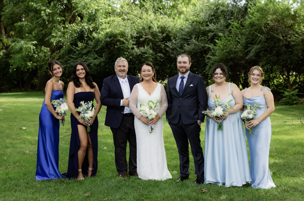 The wedding party in shades of blue in the garden at Rock Creek Mansion in Bethesda