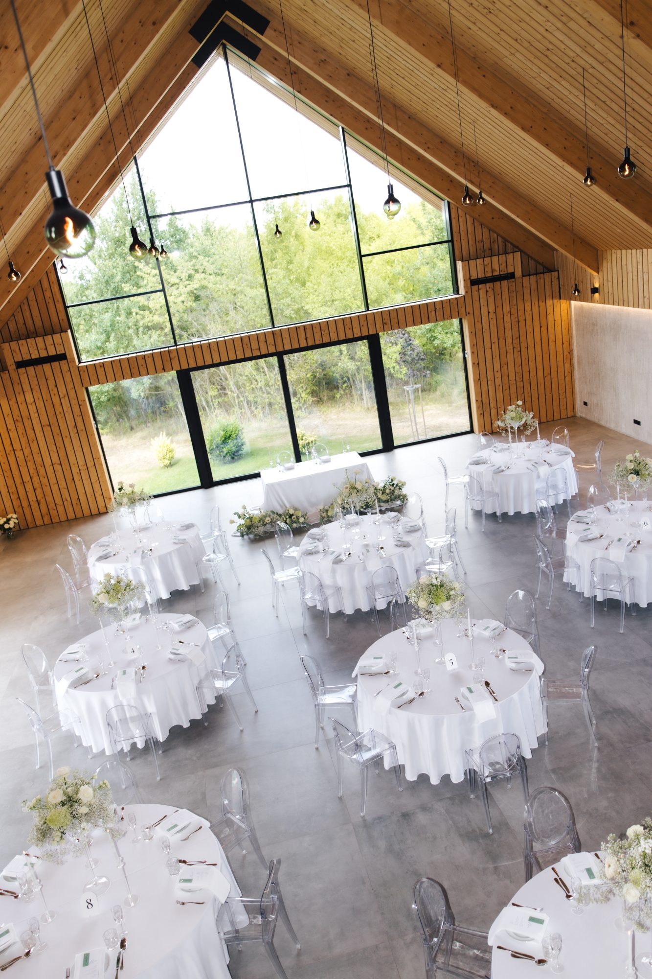The light filled timber wedding hall set for 70 guests at Samota Pierre